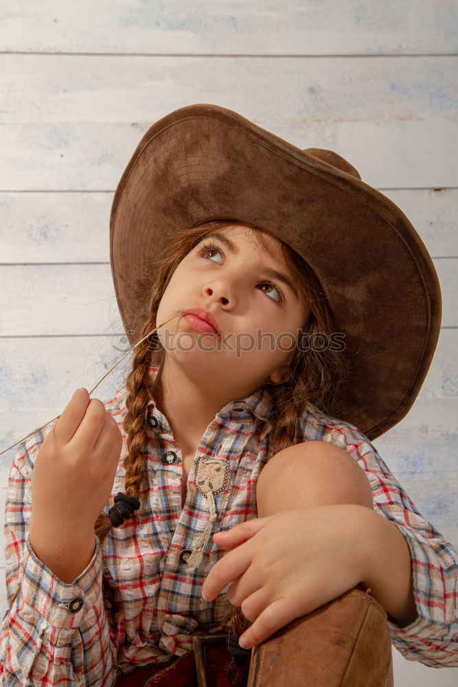 Similar – Image, Stock Photo Beautiful girl disguised of witch decorating a pumpkin at home.