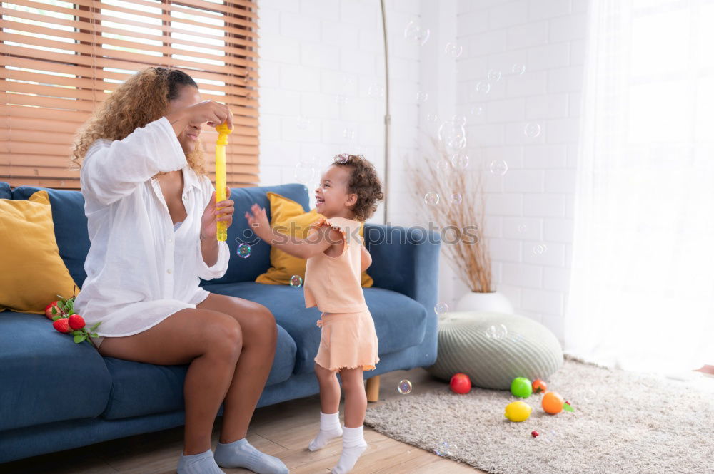 Similar – caucasian mother and son relaxing together on couch at home