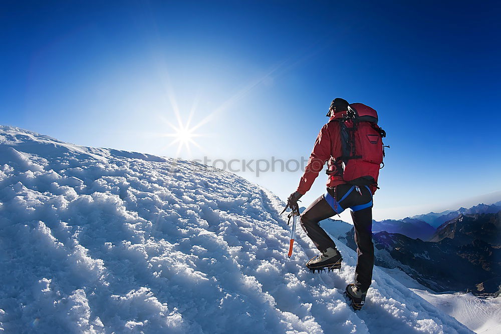 Similar – Image, Stock Photo Mountaineer reaches the top of a snowy mountain