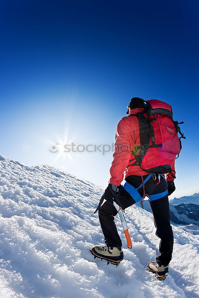 Similar – Image, Stock Photo Mountaineer faces a climb at the top of a snowy peak.