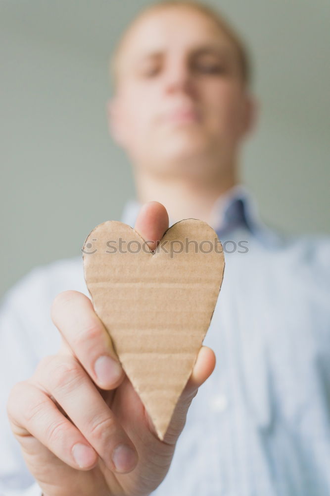 Similar – A rock with the word love written on it.