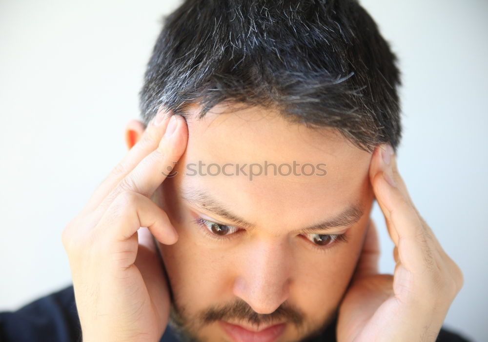 Confident attractive mulatto man in urban environment