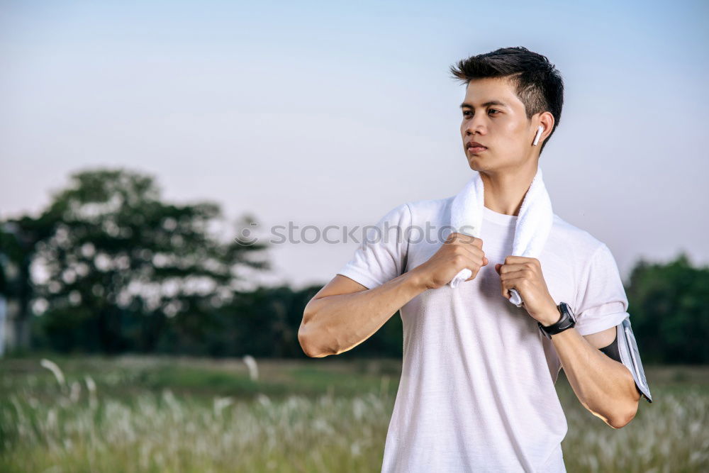 Similar – Image, Stock Photo Young man in sportswear leaning on metal fence and posing on sta