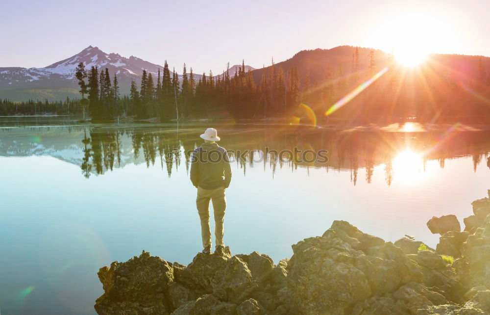 Similar – Mountain lake, woman standing