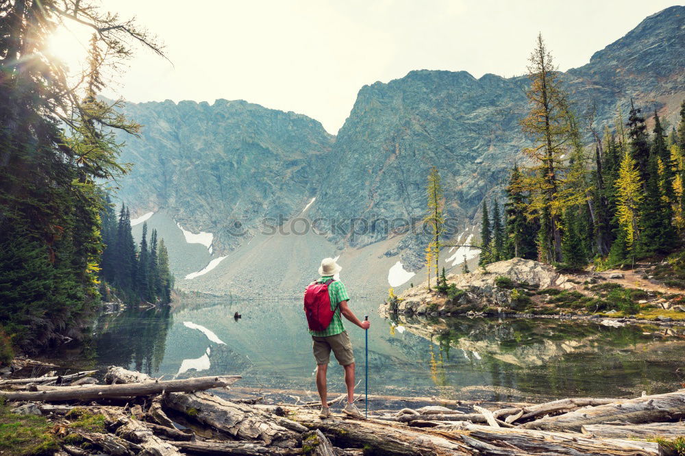 Similar – Woman refreshes herself while hiking