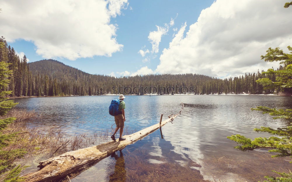 Similar – Image, Stock Photo Man with backpack on trunk