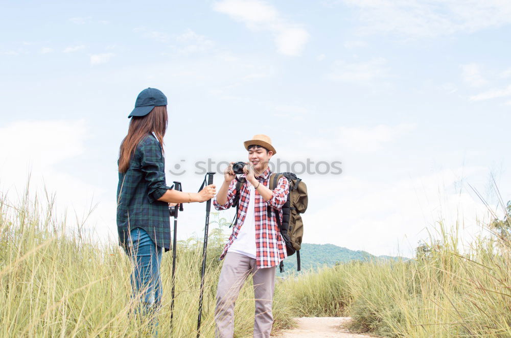 Similar – Image, Stock Photo Smiling young woman and man sitting on a pier over the sea