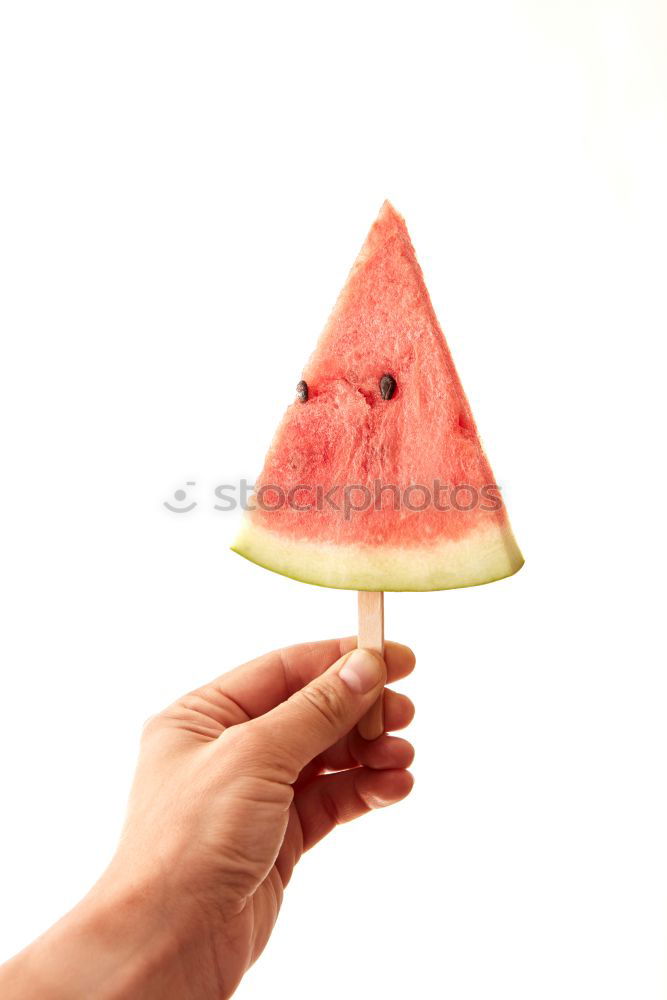 Not so young but happy Caucasian woman chewing watermelon