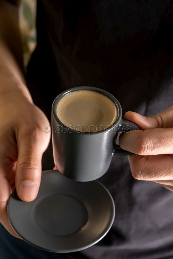 Similar – Hands with coffee cups on table in a urban cafe.