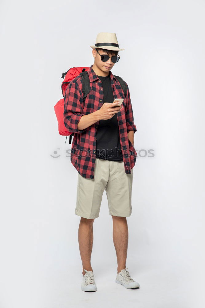 Similar – Portrait of young skateboarder man with bad boy face in the middle of the street.