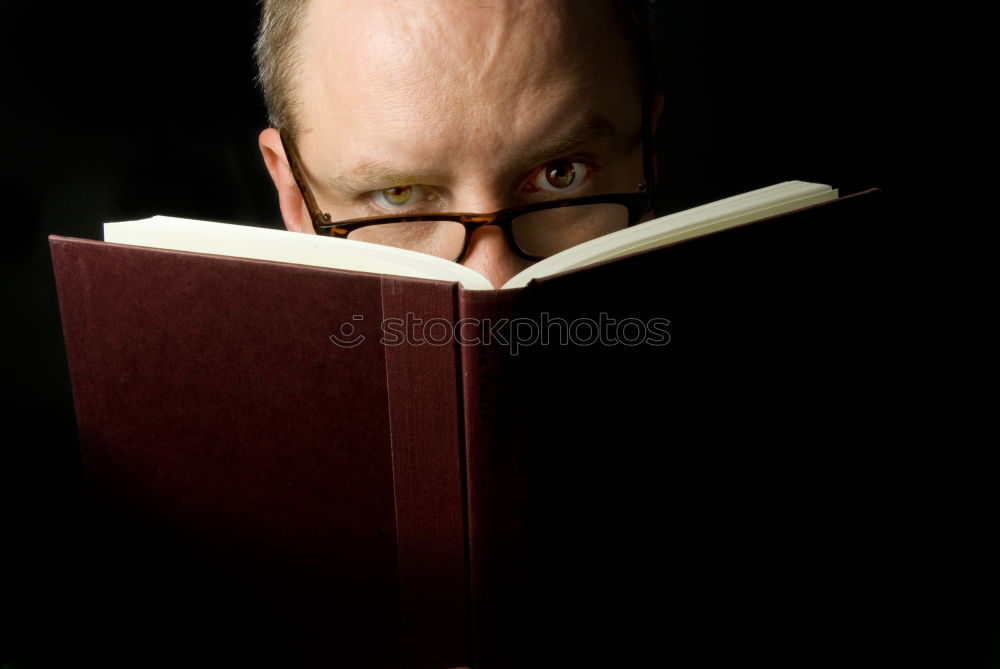 Woman behind an open book