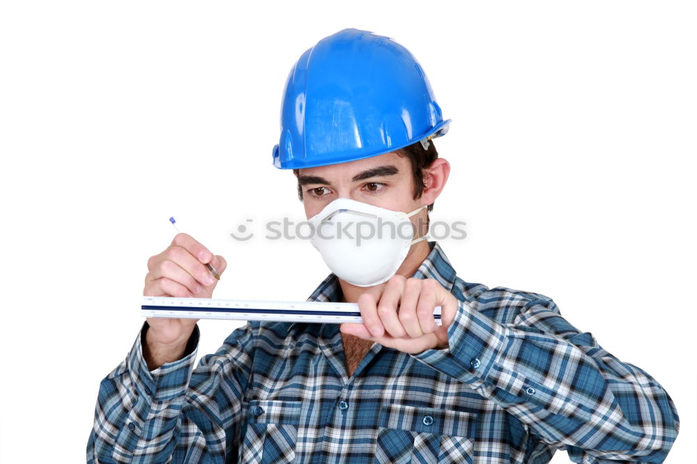 Similar – Workman in protective mask and glasses standing on street