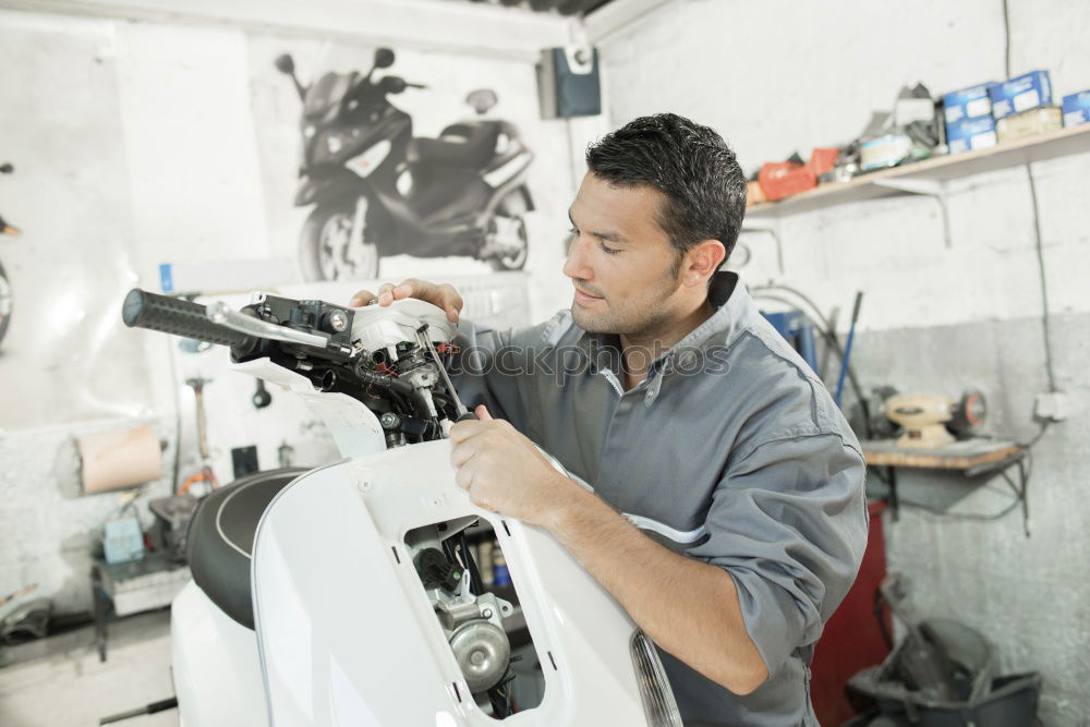 Similar – Image, Stock Photo Mechanic cleaning a motorcycle
