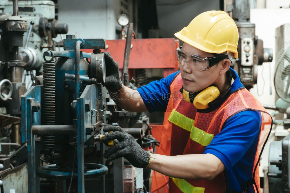 Similar – Image, Stock Photo female mechanic fixing a compressor enginge using a wrench