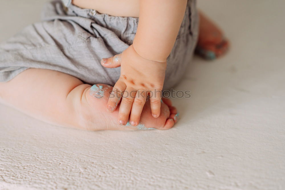 Similar – Image, Stock Photo 6 month old baby seated in high chair reaching into bowl of banana pieces; baby led weaning method