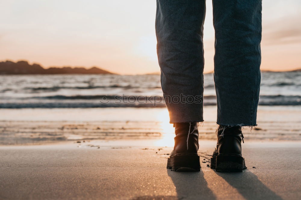 Similar – Image, Stock Photo Legs of man sitting at cliff