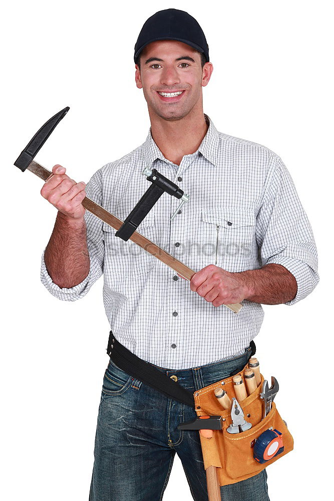 Similar – Worker man with hammer drill and building level at construction site