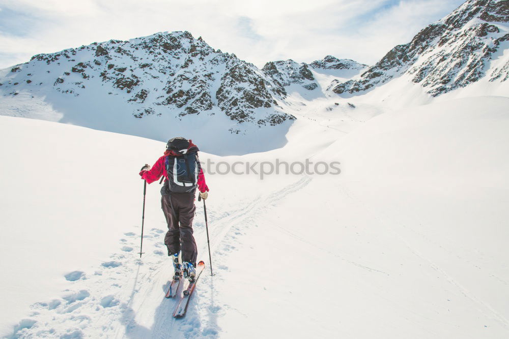 Similar – Image, Stock Photo Snowboarder goes downhill over a snowy mountain landscape.