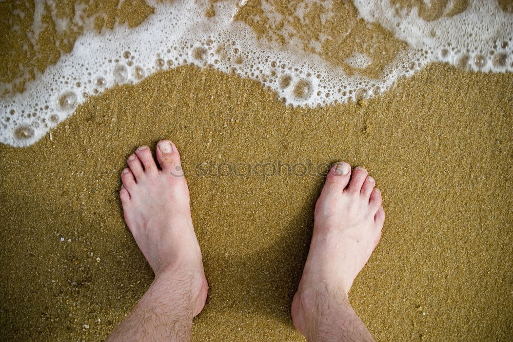 Similar – Feet in the sandy beach