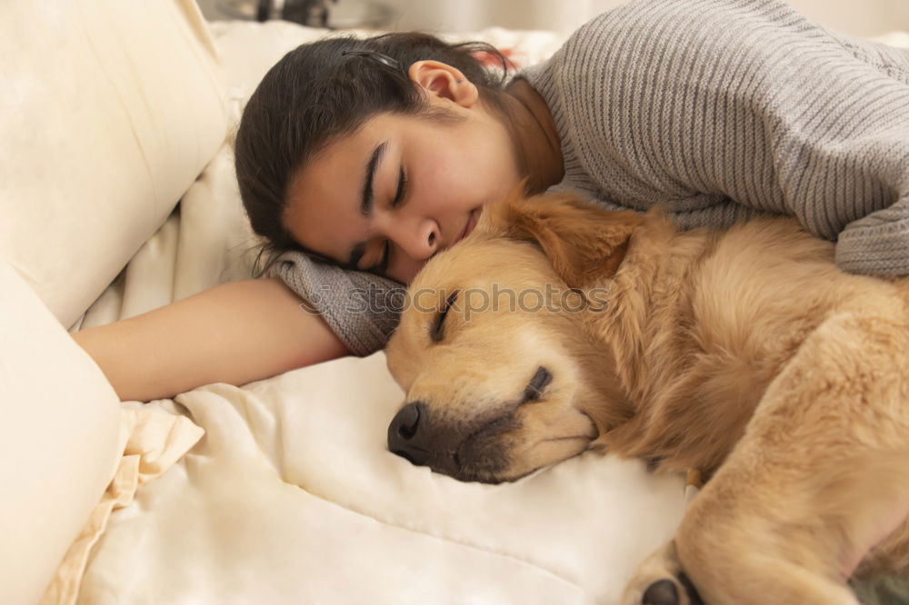 Similar – Young man sleeping with his dog