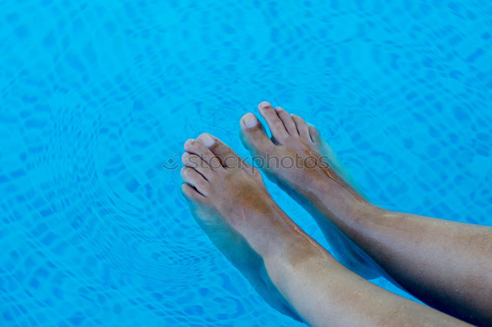 Similar – Man feet in the pool water