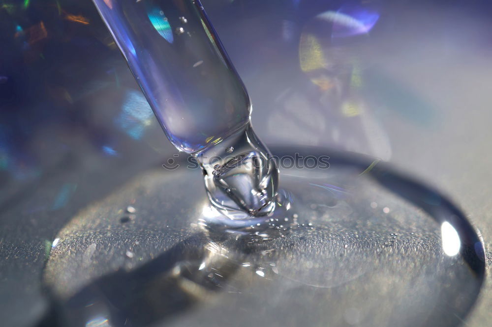 Similar – Half glass of water standing on the counter