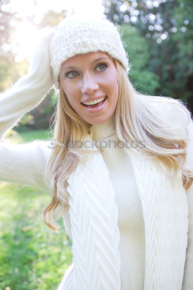 Similar – young woman 30 years in snow with red coat and leopard dress blond hair curly happy hopeful street