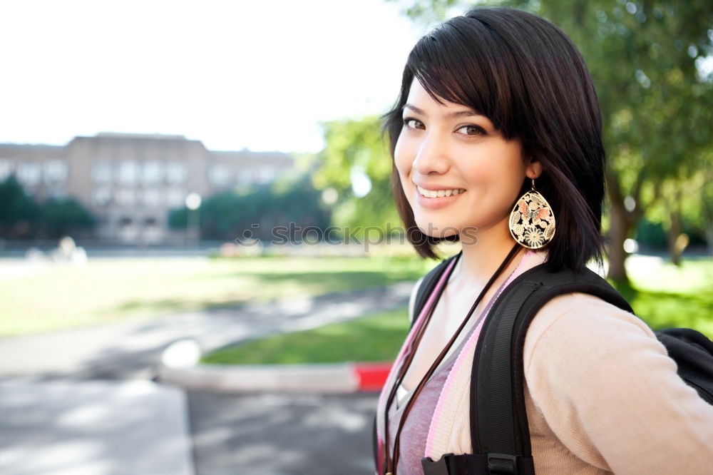 Similar – A young woman listening music on digital tablet sitting