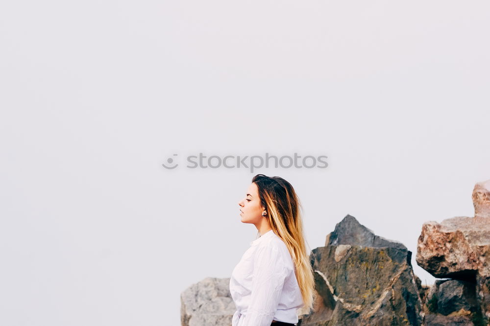 Similar – Thoughtful woman at lamp post