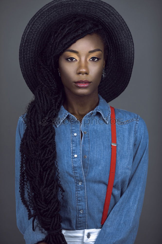 Similar – Stylish black woman in trendy outfit in studio