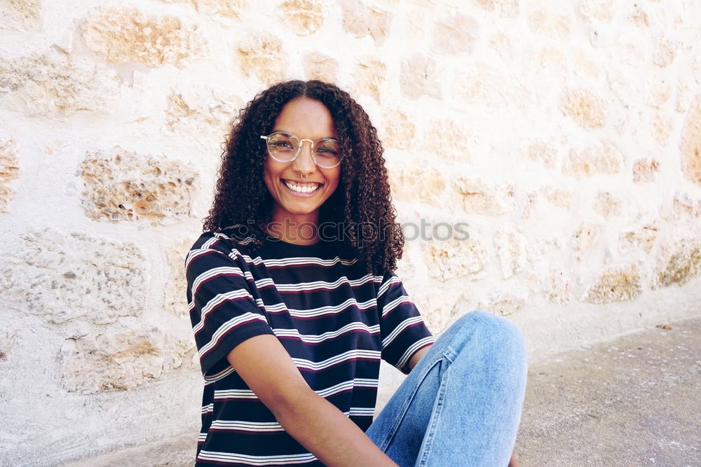 Similar – Young happy woman surrounded by green leaves