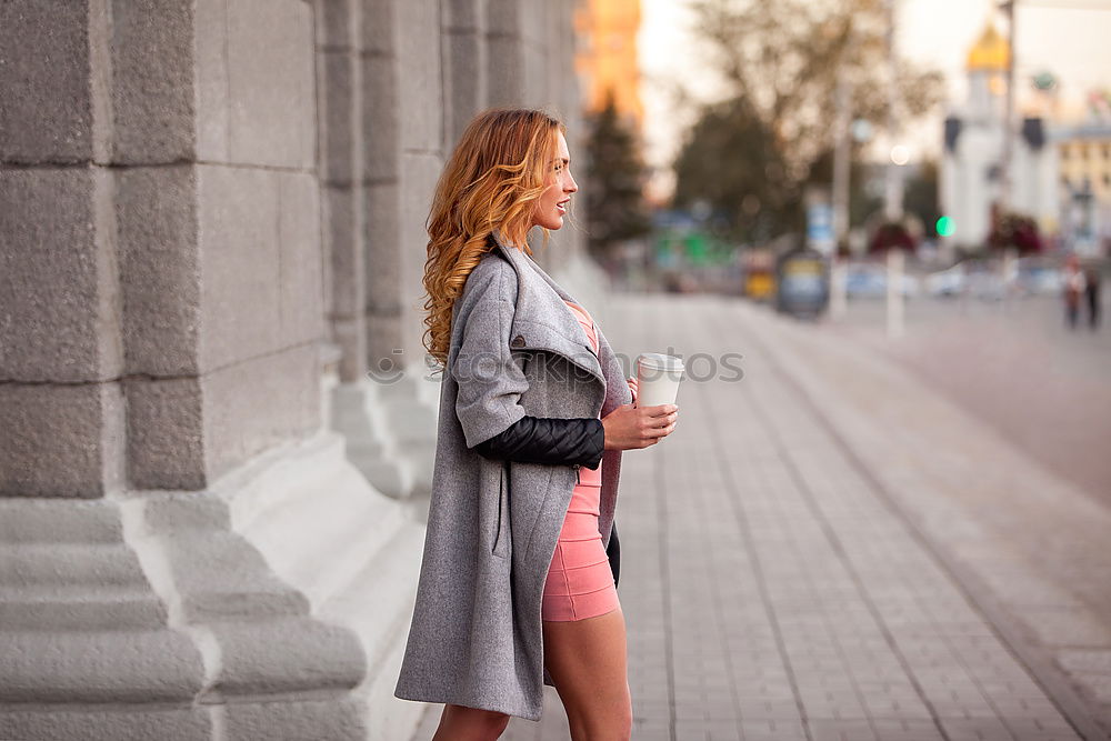 Similar – Young woman posing on stairs on street