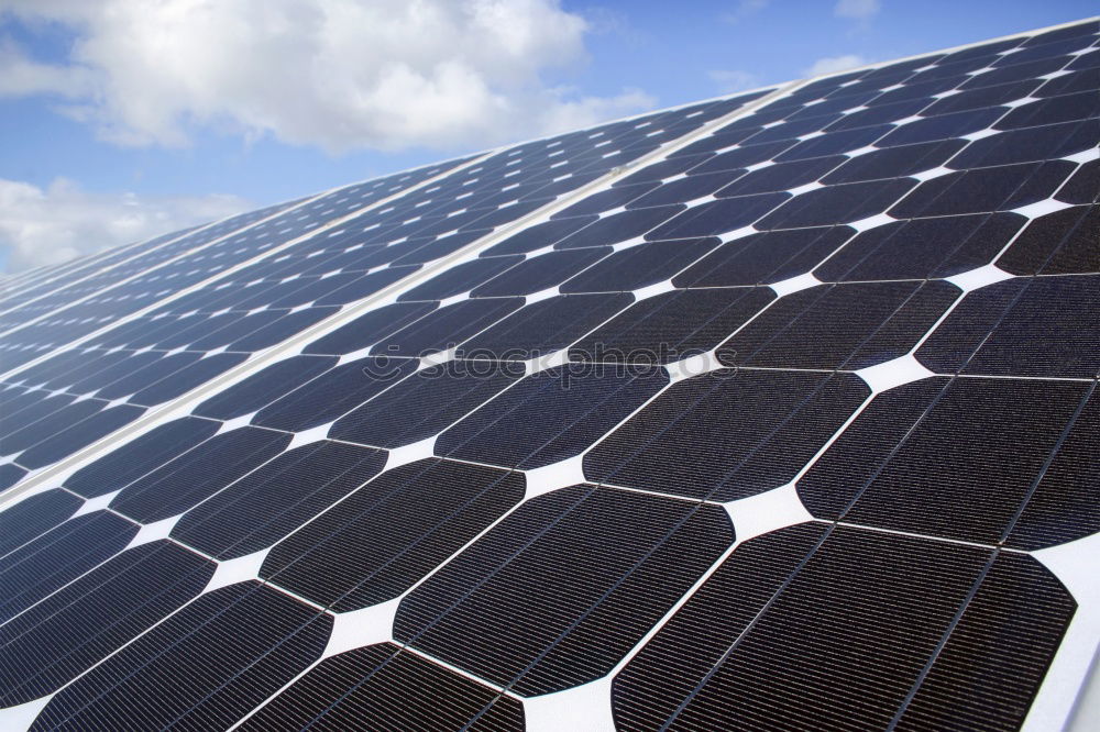 Similar – Image, Stock Photo An area of many photovoltaic panels. Solar power plant on an industrial roof , many solar panels , photovoltaics