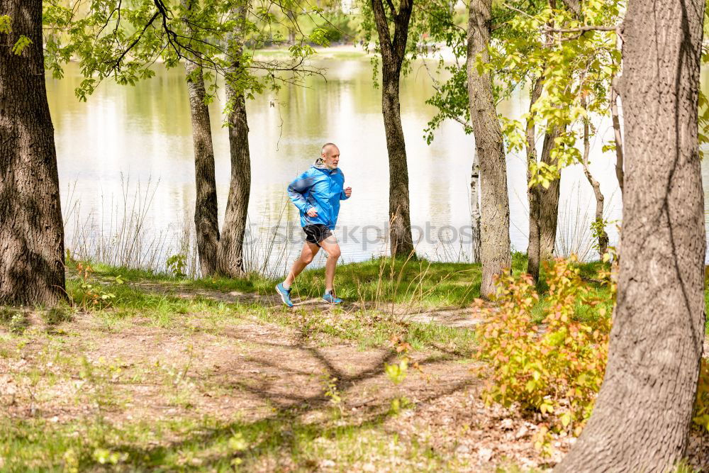 Similar – Senior Man Running in the Forest