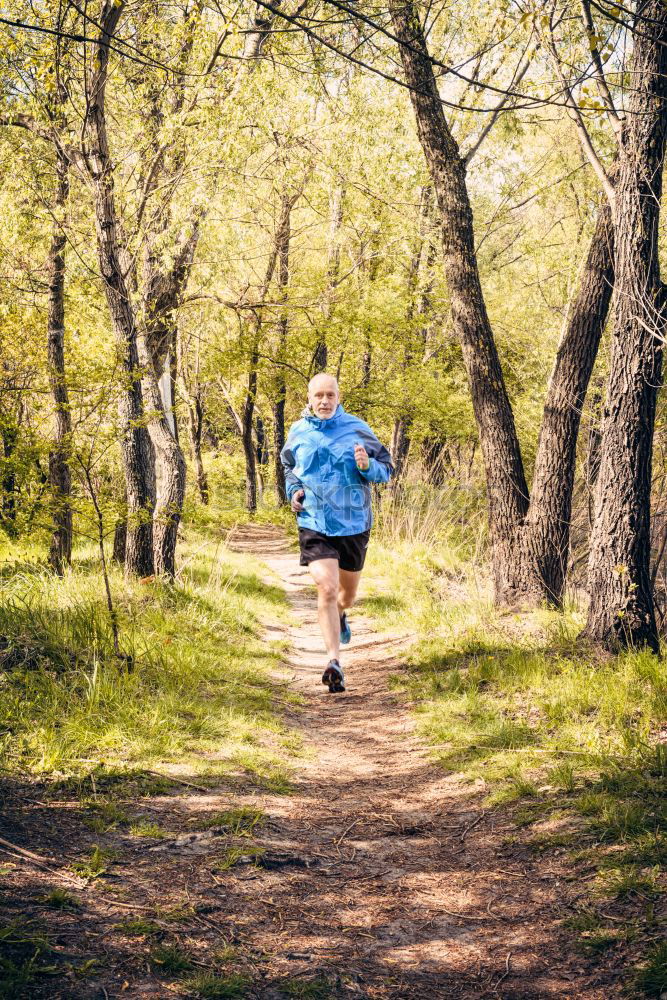 Similar – Senior Man Running in the Forest