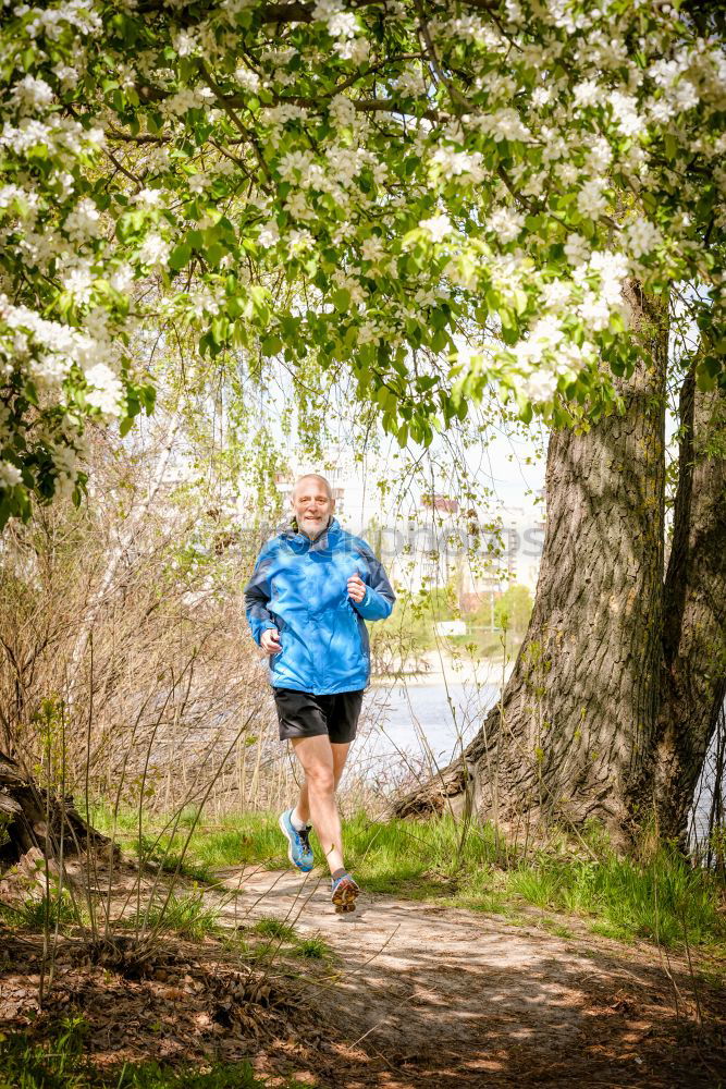 Similar – Senior Man Running in the Forest