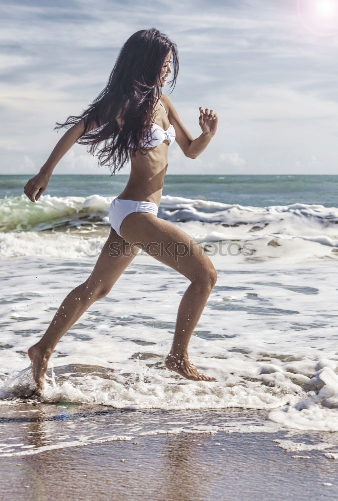 Similar – Image, Stock Photo Beautiful young woman wearing a bikini in a wooden foot bridge at the beach