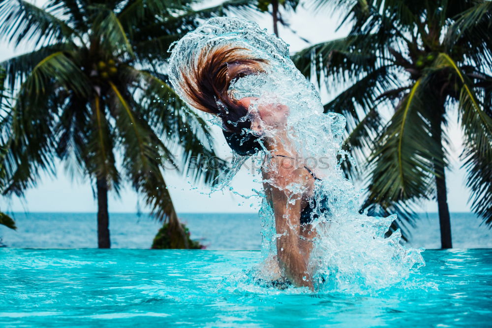 Similar – junge Frau im Pool hält ein Glas Weißwein in die Höhe während ihr das Wasser bis zum Hals steht