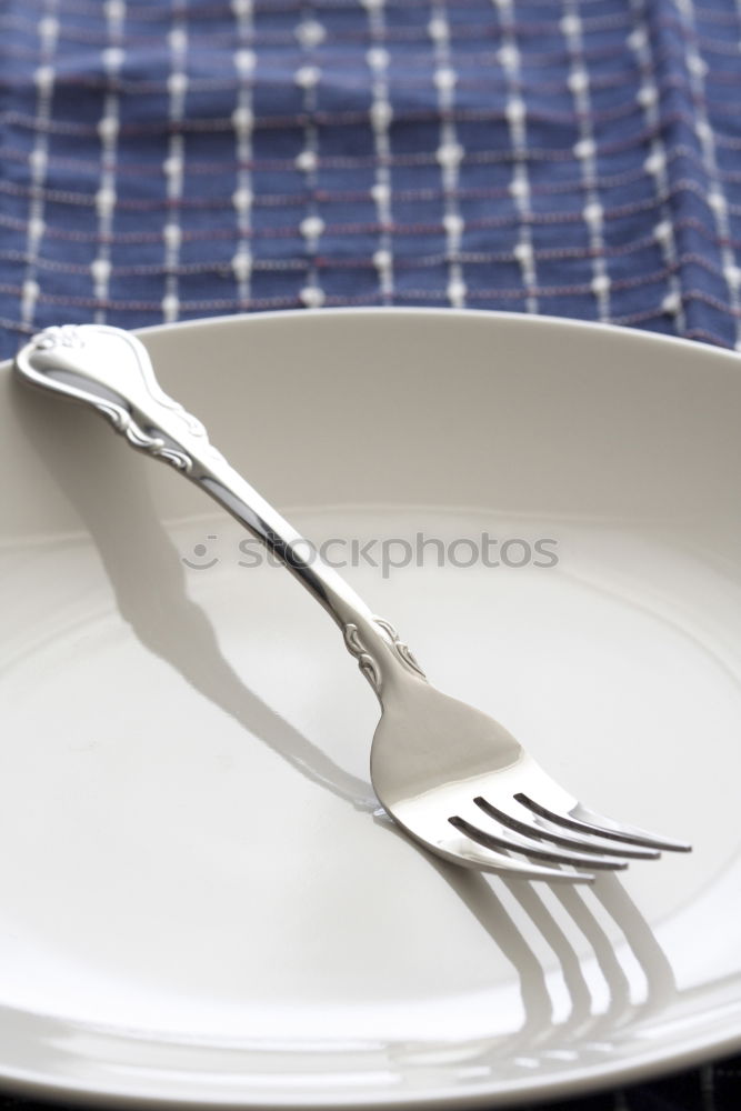 Similar – White dish with iron cutlery