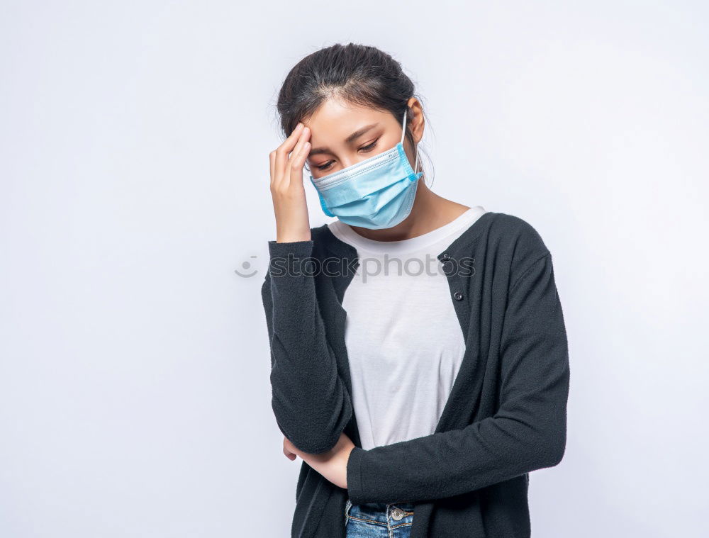 Similar – Female teenager in protective mask standing near electric scooter