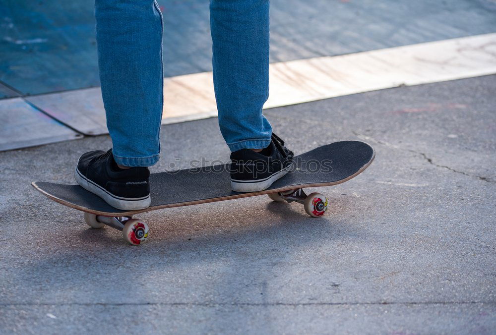 Similar – Man with tattoos holding skateboard at shore. Back view.