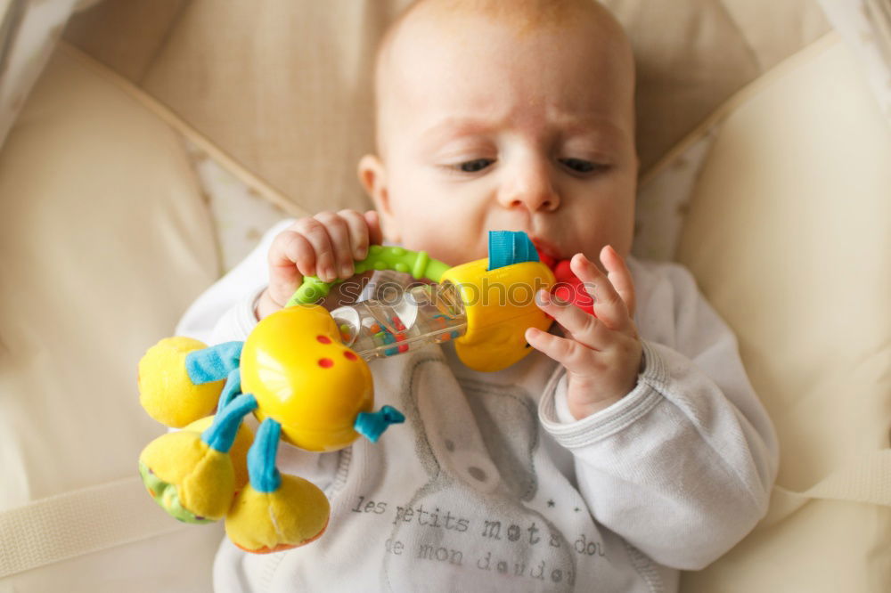 Similar – Image, Stock Photo Baby girl two months old looking at a doll