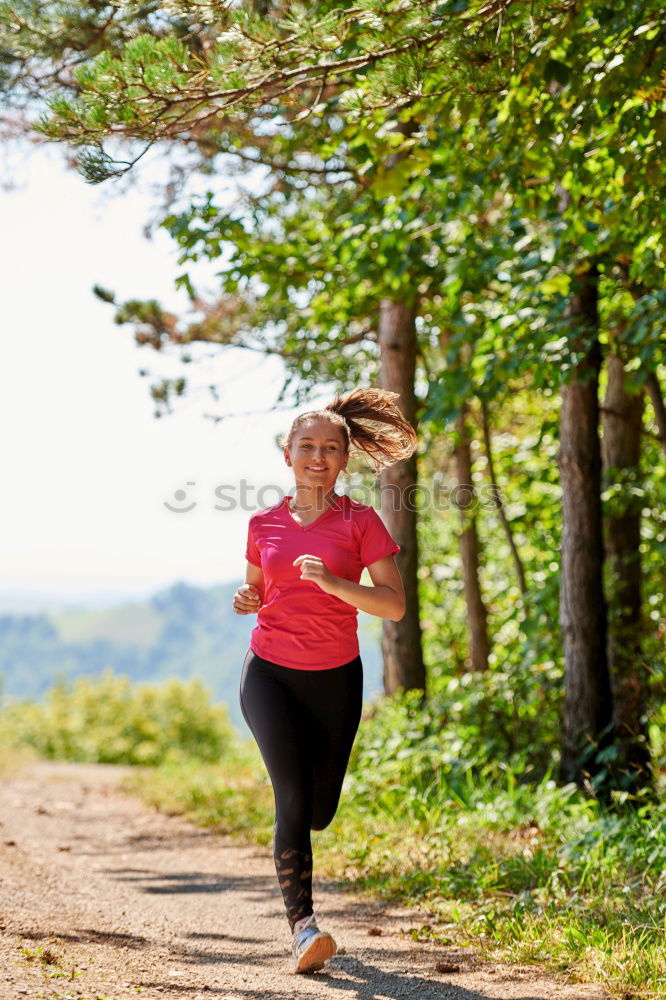 Similar – Image, Stock Photo Athletic woman out jogging in a forest