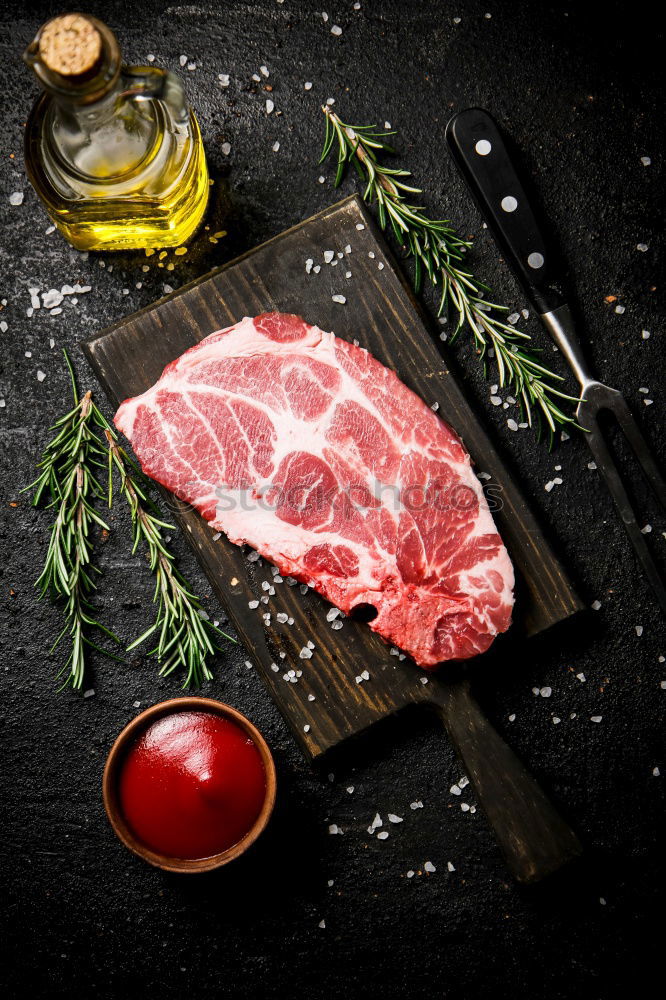 Similar – Image, Stock Photo T-bone steak on grill pan with meat fork, oil and spices