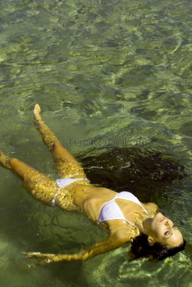 Similar – Young woman in a pool enjoying the water