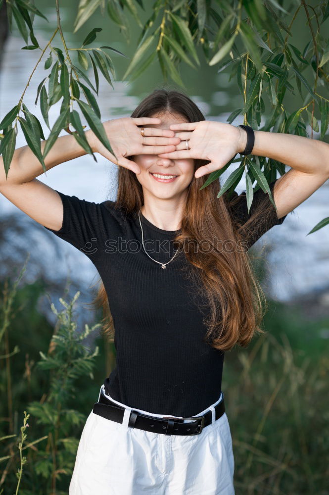 Similar – Foto Bild Frau mit Rock und Bluse greift sich in Haare