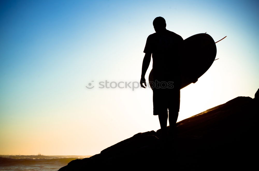 Similar – Image, Stock Photo Young man reflected on the beach in the waves