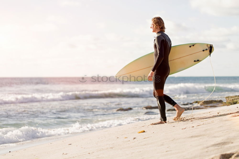 Similar – Man with skateboard looking at sea