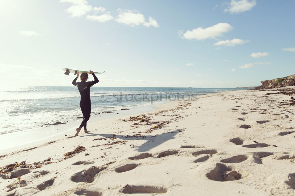 Similar – Naked man runs liberated on the empty beach towards the undulating sea