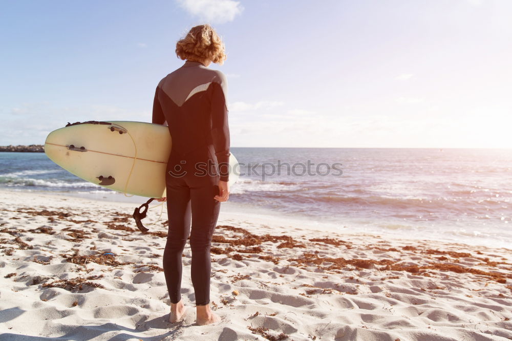 Similar – Man with skateboard looking at sea